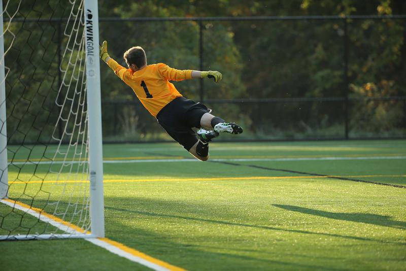 Goalie George Wangensteen dives for a ball in the teams 3-2 win over Dalton on Fall Sting. Photo courtesy of David Wahrhaftig.