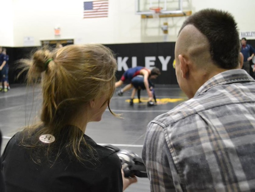 Demetra sits with her brother Damis to talk strategy before hitting the mat. Photo by Diane Petro.