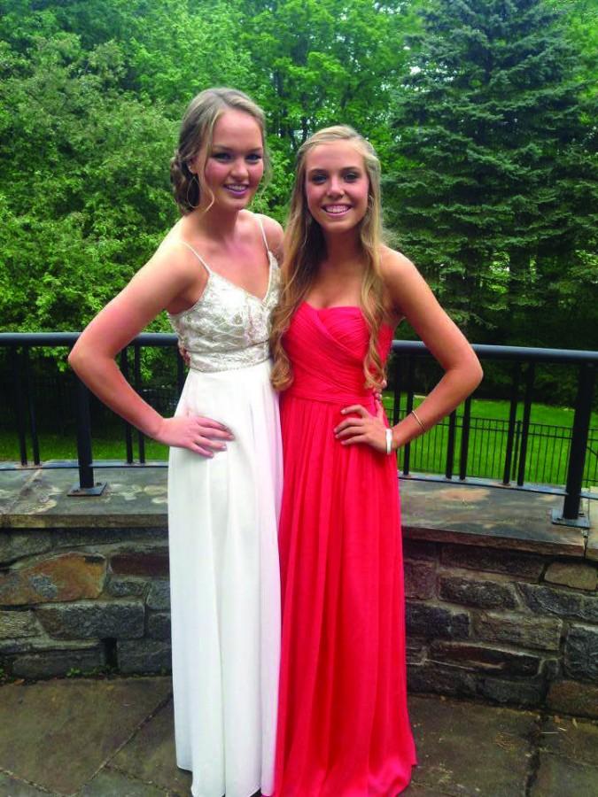 Seniors Natalie Gustin and Andrea McCree pose in trendy dresses at Prom 2014.