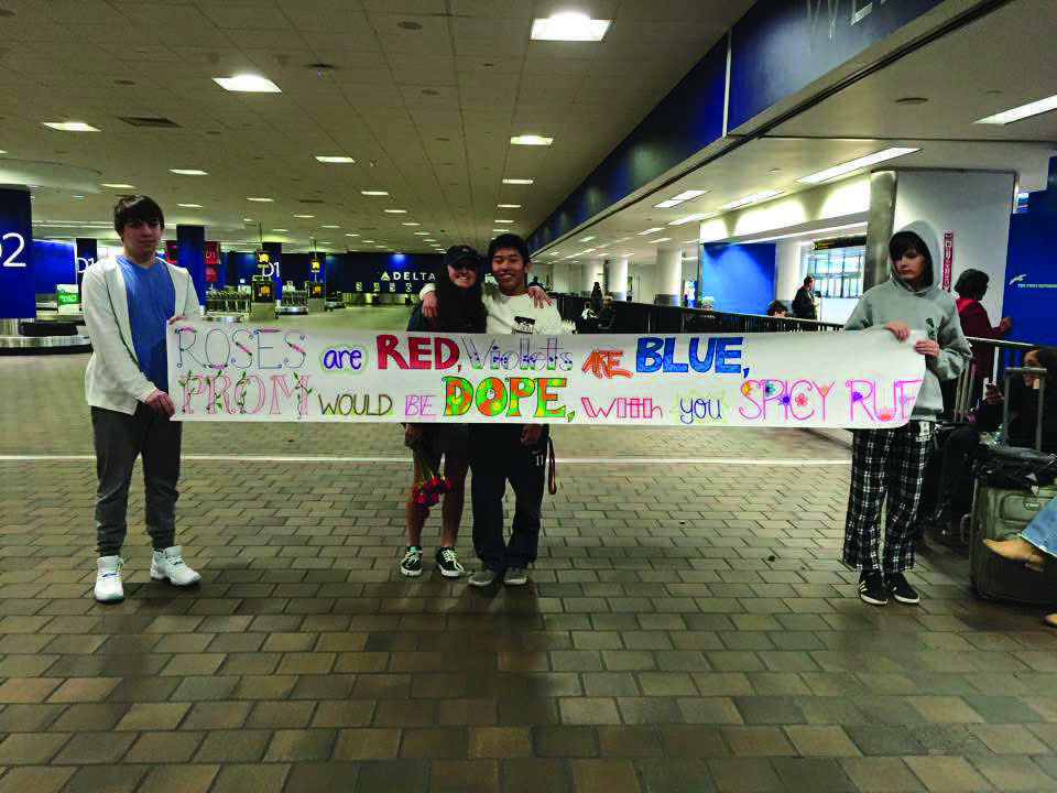 Junior Greg Chung asks Junior Kat Cucullo to prom in LaGuardia Airport.
