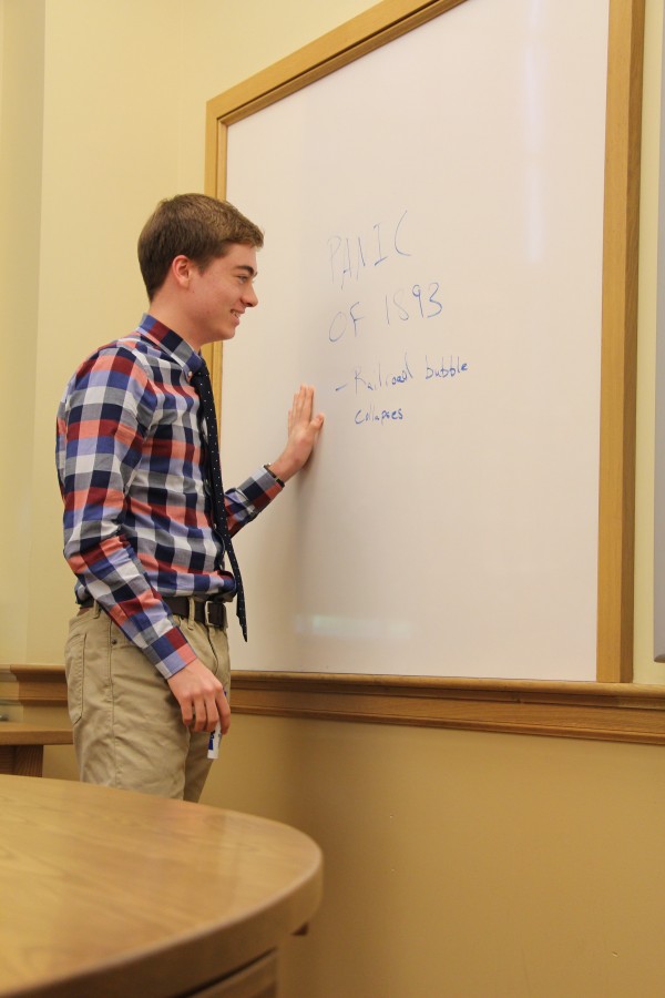 Michael Rover assists a sophomore U.S. History class.
