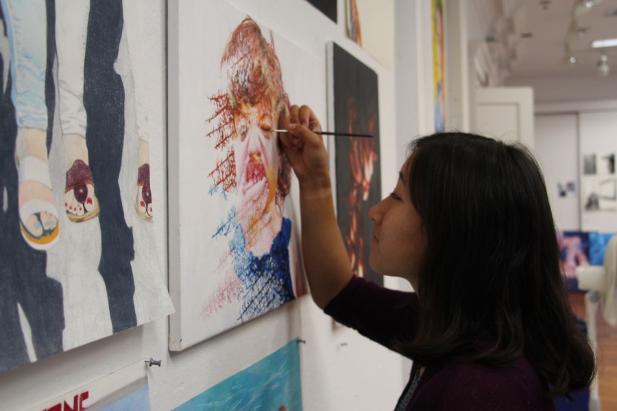 Senior Erin Jung works on her AP Studio Art concentration.