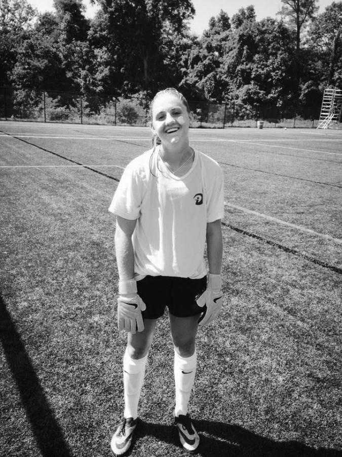 Senior Sammy Mueller swelters with her shirt on in the August heat.