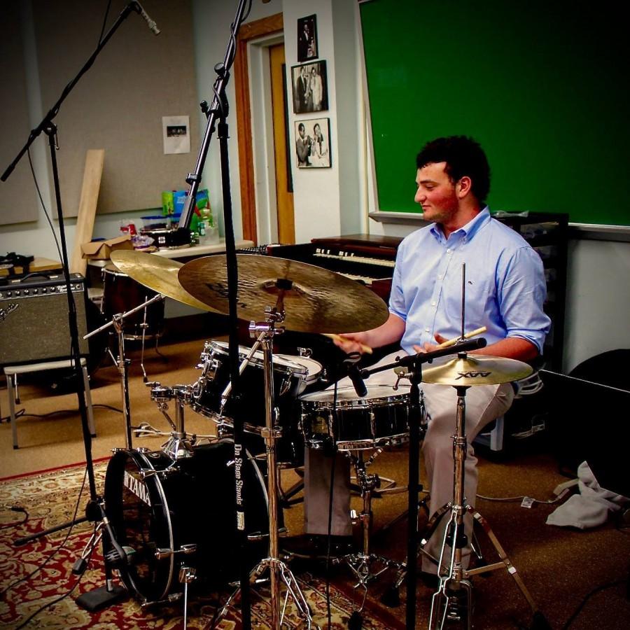 Josh works to further improve his drumming abilities.