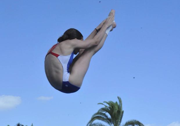 Kit Greenberg, a nationally ranked diver, often wakes up before dawn to train for diving.
