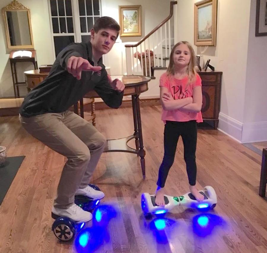 Malcolm+Roesser+and+his+sister+skillfully+use+their+hoverboards+to+travel+around+their+house.