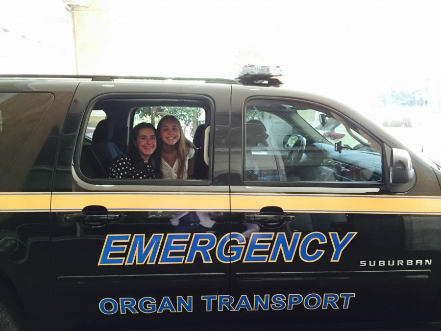 Senior Katie Bogart rides in an emergency vehicle as part  of her summer internship.