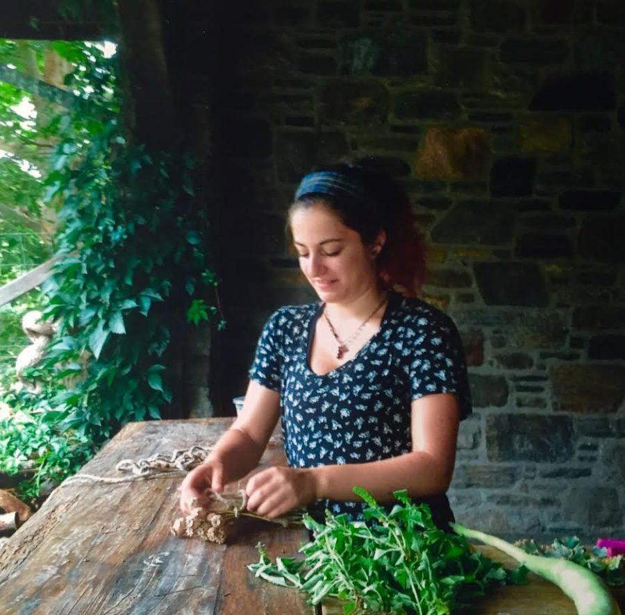 Isabella Yannuzzi works at Stone Barns Center bundling herbs.