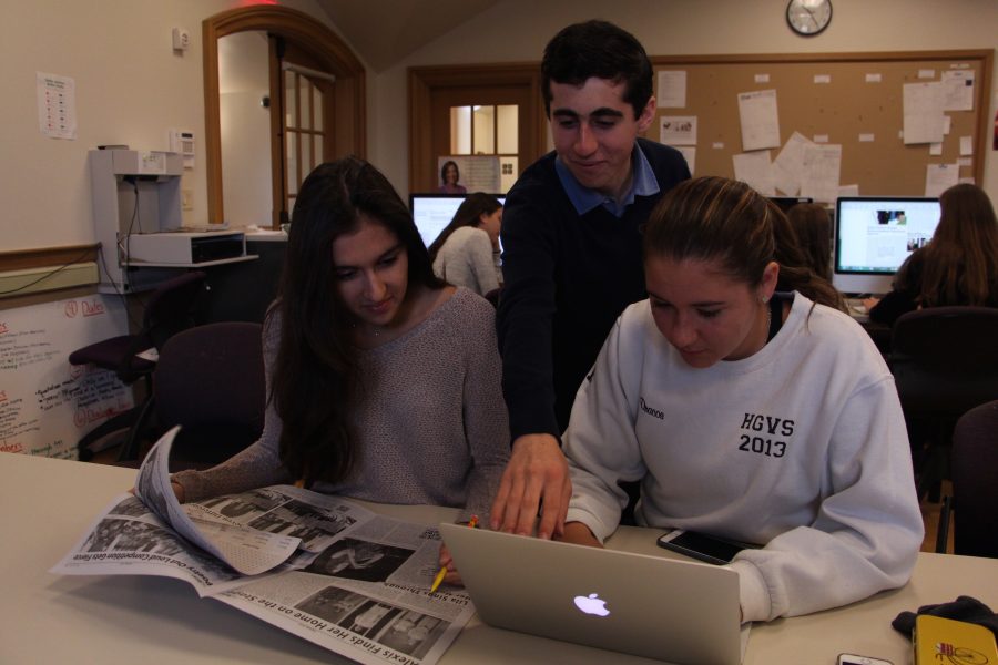 New editors Roya Wolfe, Benjy Renton and Joy Dracos look over past issues of the paper.