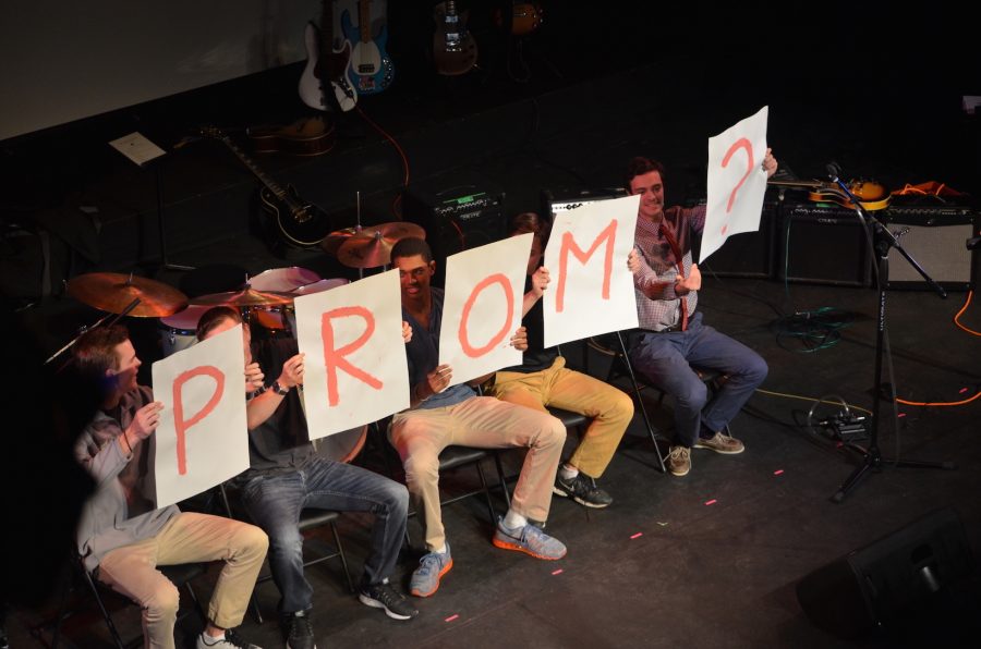 Senior Eli Pinkus “promposes” to fellow Senior Caterina Moran during one of the most attended school events, Coffeehouse, with the help of 5 friends.