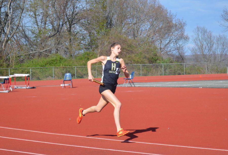 Junior Luisa Stalman runs in the 4x400m relay.