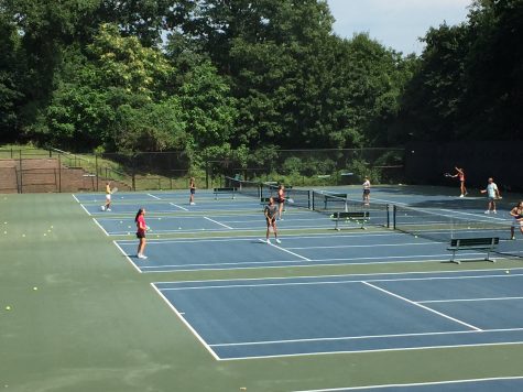 The Girls’ Tennis team players compete against each other during Varsity tryouts.
