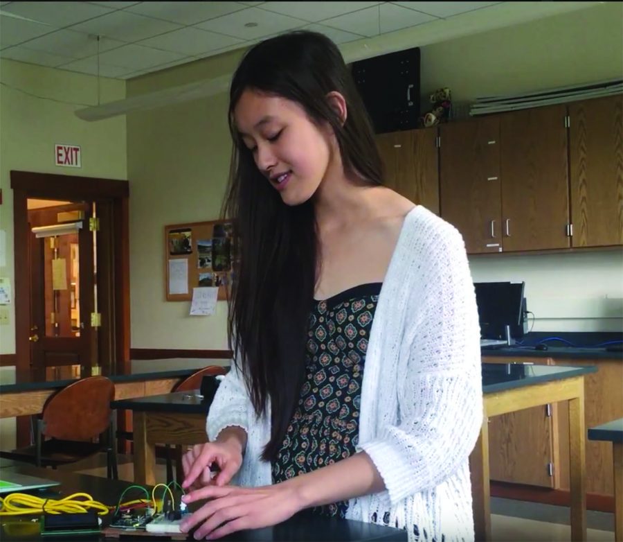 Freshman Kellsie Shan operates a light theremin that makes sound based on different movements.
