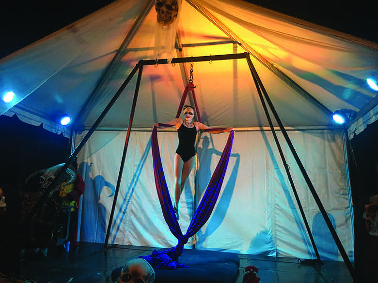 A trapeze artist performs at Horseman’s Hollow.