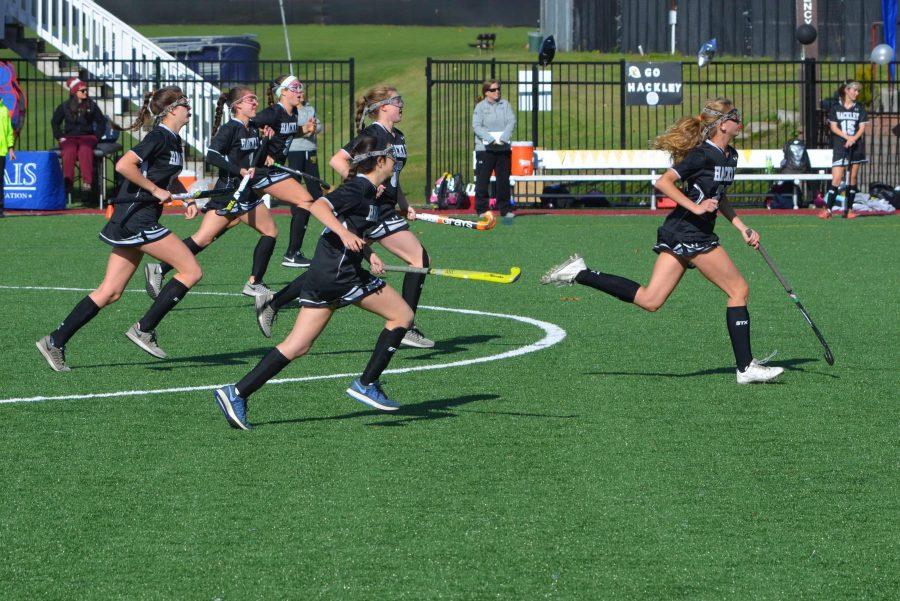 The Field Hockey team rushes down the field at the NYSAIS Championships.
