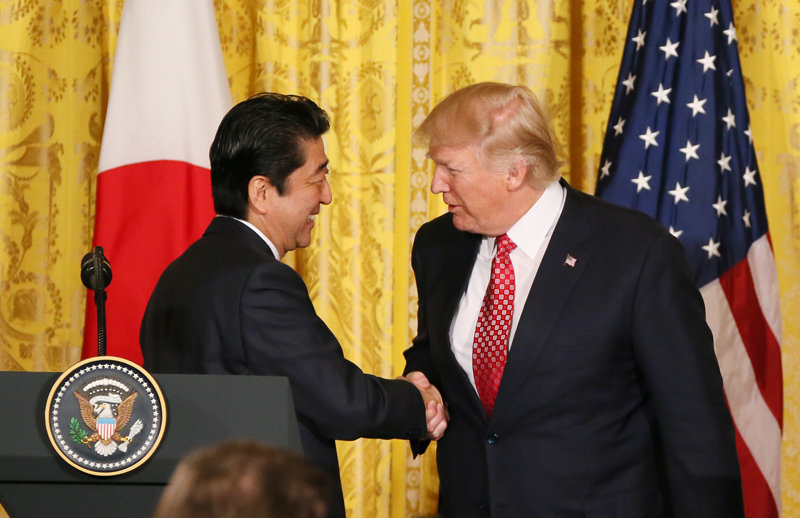 Japanese Prime Minister Shinzō Abe and President Donald Trump shake hands on February 10, 2017.