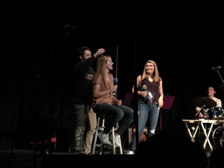 Sophomore Alexander Goldman play an acoustic version of “Message in a Bottle” by the Police. This year’s coffeehouse was hosted by seniors Lilliana Khoshroshahi and Francesca Doctors who offered audience volunteers minute-to-win-it games in between numbers for a chance to crack a raw egg on one of their heads.