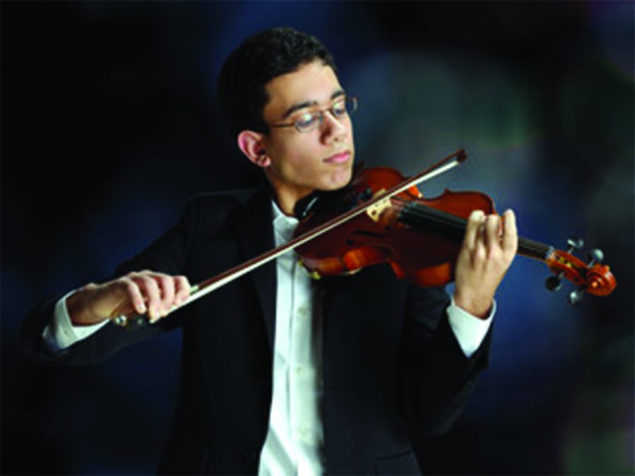 Rohun Rajpal plays his violin in preparation for his performance at Carnegie Hall.