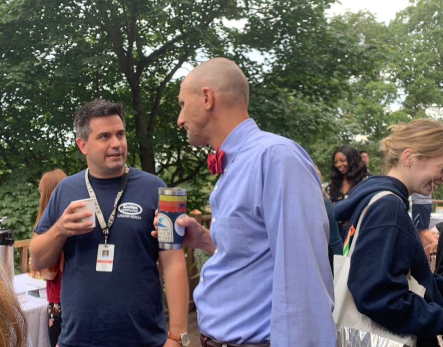 Senior dean Chris Loomis and Head of School, Michael Wirtz, survey the scene on the porch of the Gage House, where the annual senior breakfast is hosted each year. The Gage House is positioned directly on the quad, causing a seamless integration between the house and the school.