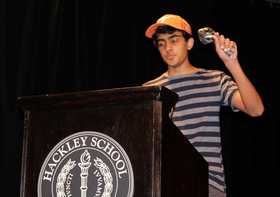 Arav Misra holds up twenty four spoons, representing the limited time we have in a day. He argues that school eats up every chunk of student life as it is so we should try to stop obsessing over the minutia of life.