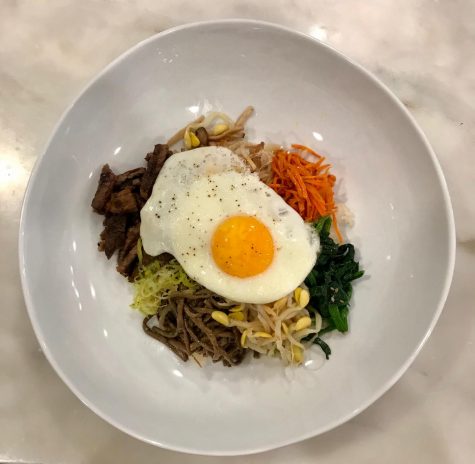 This Bibimbap is made from mushrooms, carrots, spinach, bean sprouts, rice, and a fired egg on top. The first bibimbap recipe came from the 19th century and traditional bowls may also include kimchi and different types of meat. 