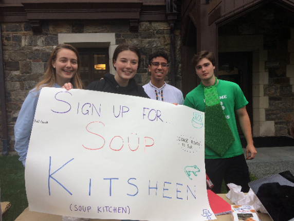 Club leaders Emma Lauerwald, Emma Brennan, Gabe Baez, and Sean Ford (from left) attract underclassmen to sign up for the soup kitchen club. The group has a devoted band of members who attend their community service events.