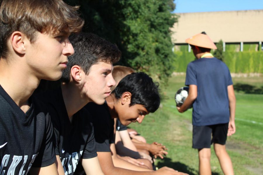 Various members of the JV A and T squads wait on the bench for their name to be called by Coach Wright to enter the game against Horace Mann.  