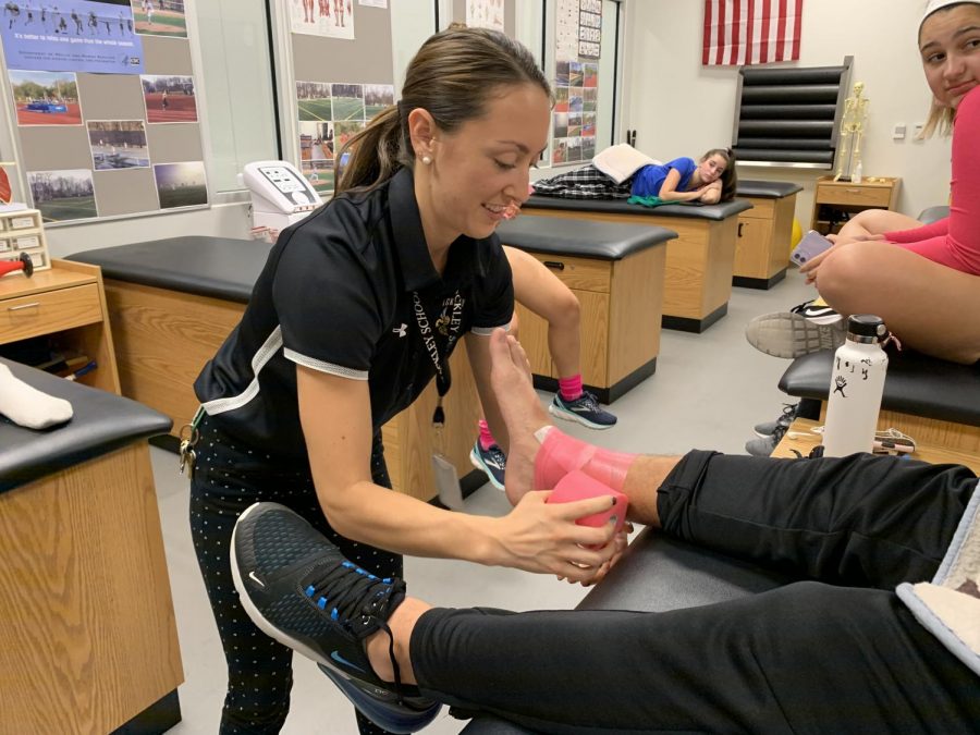 Katie works with Freshman Dan Paridis to get him ready for his soccer game. Before Kayla came to Hackley she was an athletic trainer at Rockland Community college. She graduated from SUNY Cortland in 2017 and is currently pursuing a master’s degree in Nutrition and Dietetics to become a Registered Dietitian as well as a Certified Athletic trainer.
