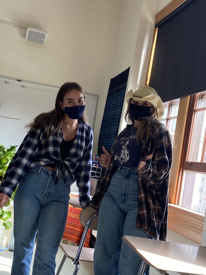 Seniors Hannah Ostfield and Mackenzie Jones wear western outfits featuring blue denim jeans, flannels, and a cowgirl hat!