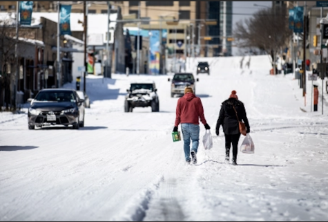 Photo credits: Rolling Stone. This image shows Texans walking through frigid weather to get their groceries. 