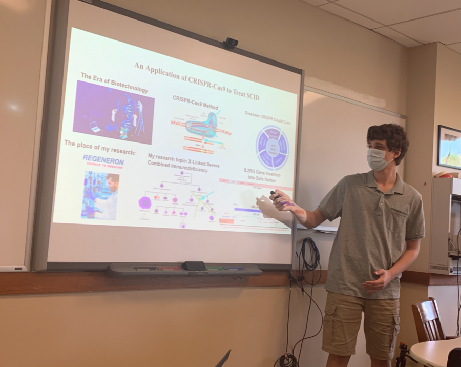 Junior Mike Potanin presents his IRP project to the class. Here, he is talking about the application of CRISPR-Cas9 to treat SCID. SCID is a disease results in a weak immune system that is unable to fight off even mild infections.