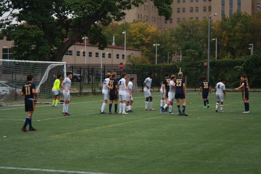 Hackley defenders match up with Trinity attackers to defend off a corner kick. The star-studded defense provided a shut-out for a 2-0 victory.