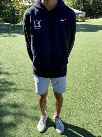 Sophomore, Caleb Bae, wears a dress code friendly outfit. Though logos arent allowed on sweatshirts, the fact that Calebs logo represents the school allows for his sweatshirt to be in dress code.