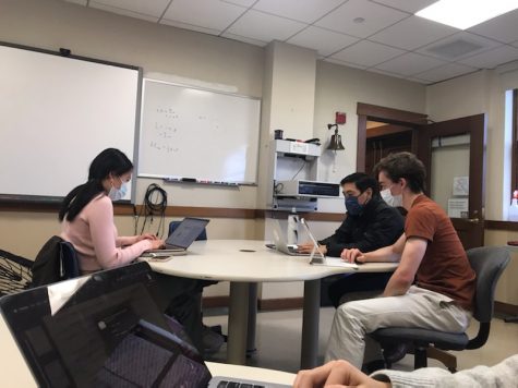 IRP members Katherine Chen and Aiden McComiskey discuss their upcoming presentations with IRP director Dr. Ying. Through IRP, Katherine and Aiden have the opportunity to pursue scientific subjects that pique their interest. 