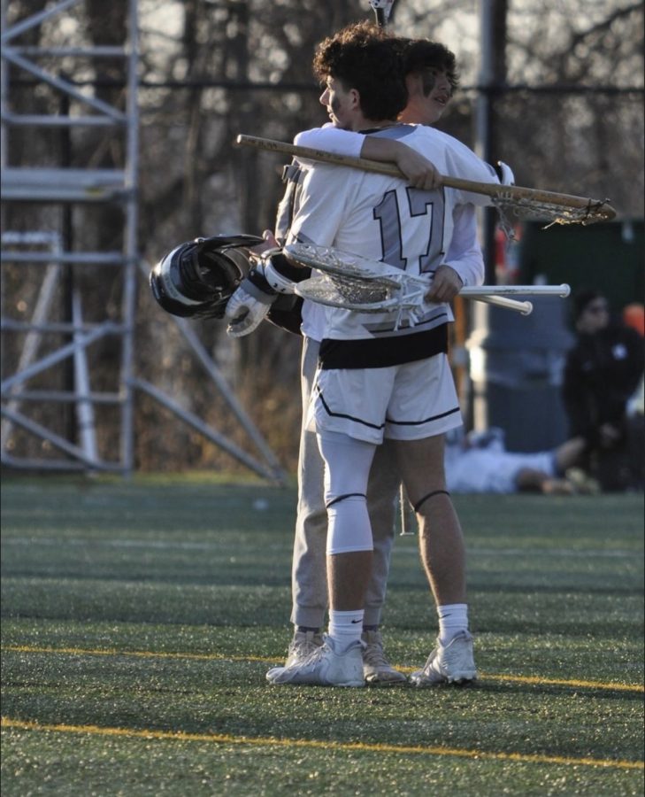 After a hard-fought win against Fordham Prep, goalie, Mac Broaddus, and Vincent Crispi celebrate their victory. Vincent and Mac played a big role in their victory helping defend the goal and coming up with big saves.