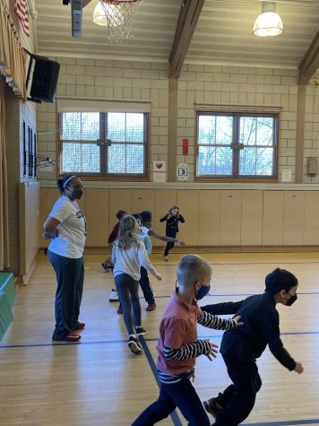 April Williams teaches a physical education class to lower schoolers. The first graders played tag and other active games.