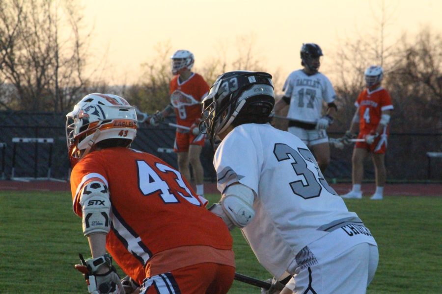 Nerves were at an all time right as the first face-off was dropped. John Churchill(23) and a Fieldston midfielder jockey for position to run in for the incoming ground ball.  