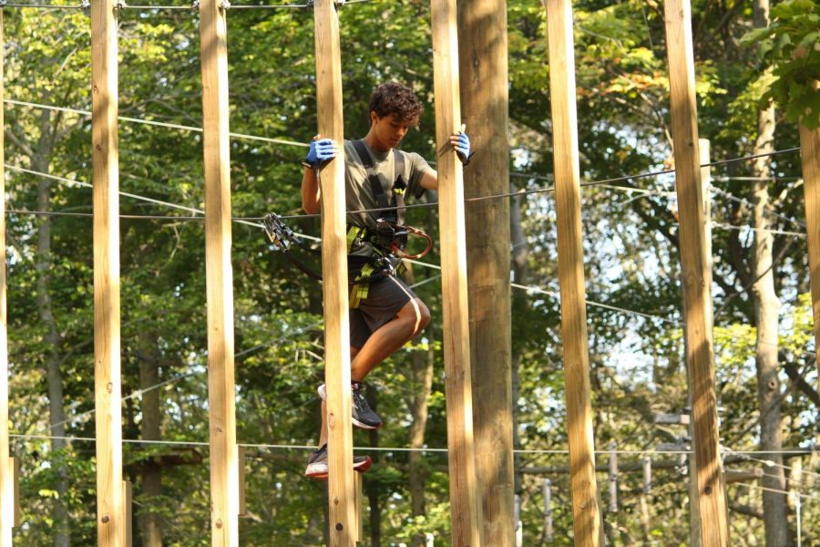 Sophomore Rafa Castro 25 completes one of the courses at Boundless Adventures, testing courage and skill.