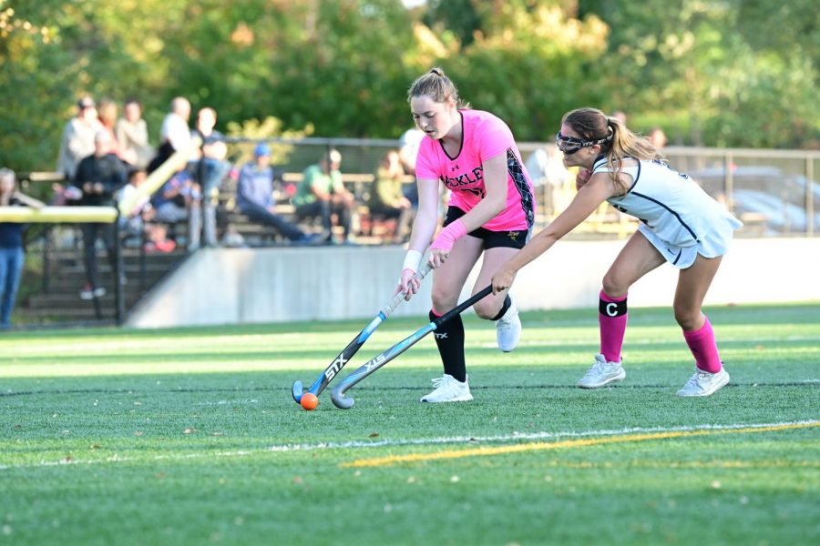 Catie+ORourke+is+deciding+what+to+do+with+the+ball+as+she+travels+down+the+field.+She+is+maneuvering+herself+around+a+King+field+hockey+player.+She+will+be+playing+field+hockey+next+year+at+Skidmore+College.