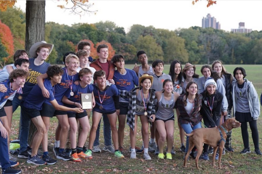 The Cross Country team poses for a picture after receiving their first place plaque for the boy’s varsity 5k race. The race took place at Van Cortlandt park in the Bronx where most meets occur.