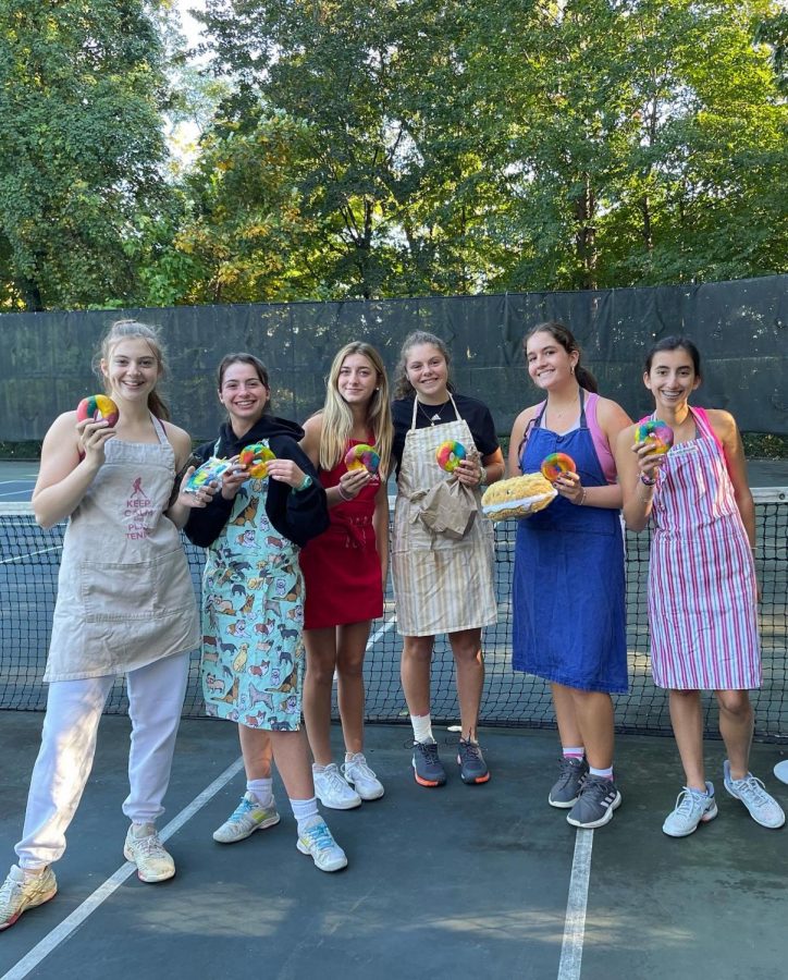 Hackley girls tennis had a color wars where their team split in two. This was team Chef holding up their bagels. HGVT has a tradition of giving out a bagel stuffed animal (pictured) when they beat or get beat 6-0.