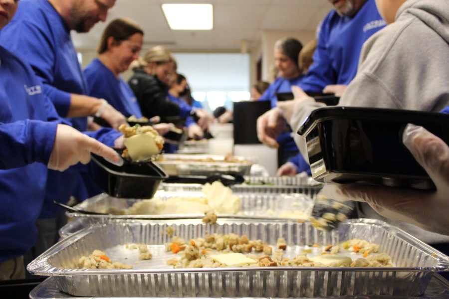 Many volunteers began their work upon arrival at the facility. Working together, they were able to plate hundreds of meals for those in need. They began by plating the cold meals for those who wanted to take them to go and heat the food up when they got home.