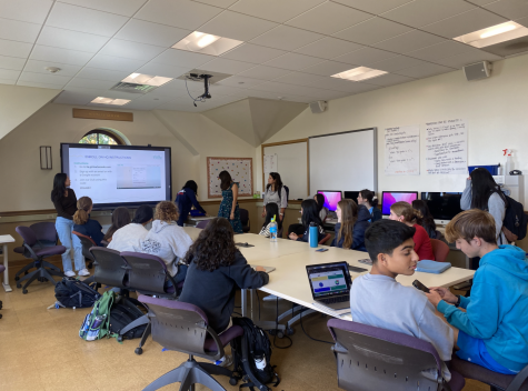 This image shows the Girls Who Code club that meets regularly to discuss topics of computer science while empowering women in STEM.