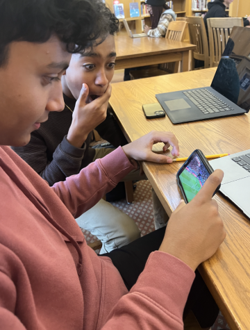 Freshmen Rohan and Riyaan enjoy the semifinal of the World Cup in the library during free time.