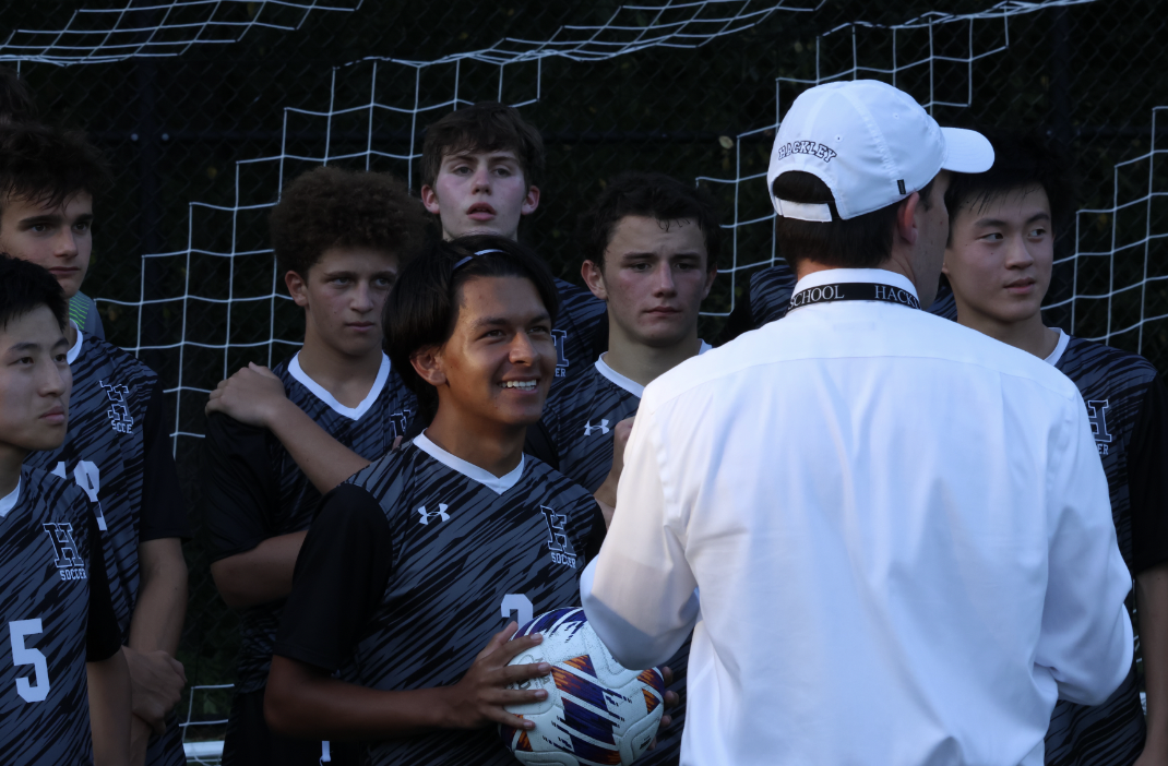 Mr+Franklin+gives+a+small+speech+to+the+Boys+Varsity+Soccer+team+after+their+game.+His+excitement+around+Hackley+sports+has+been+great+support+and+encouragement+for+all+Fall+teams.+
