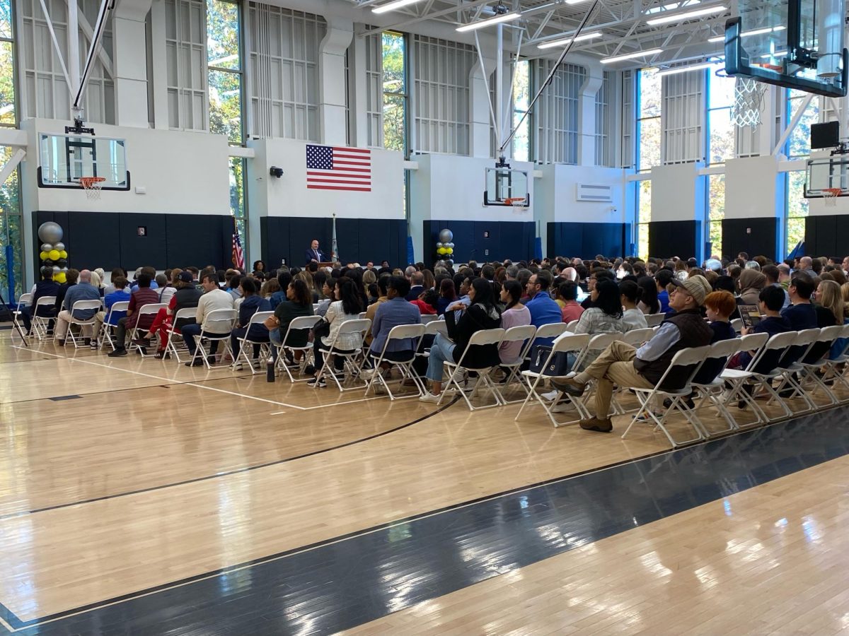 Director of the Upper School Andy King is speaking with prospective upper school families. Over 430 people were in attendance of the event. Prospective families were able to explore the Johnson Center and various upper school buildings while on campus. 