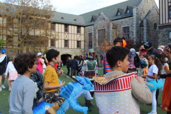 In recent years, inflatable costumes have become especially popular for young kids looking to wear something fun for Halloween. Two popular inflatable styles involve legs riding a horse or dinosaur and an alien in the midst of abducting a child. Students also enjoy dressing up as their favorite foods; this student is dressed as a cup of ramen.