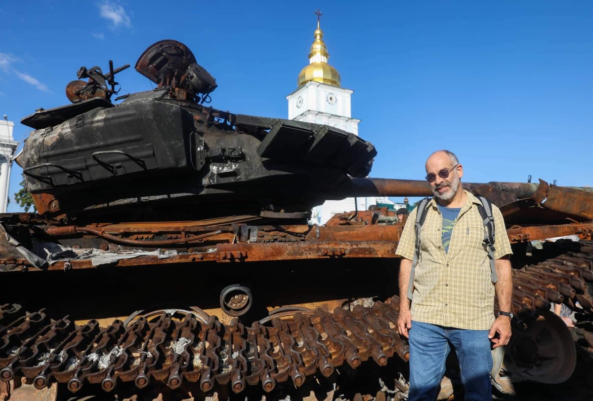 In the middle of Kyiv, Mr. Klimenko examines a captured Russian tank from the beginning of the conflict. 