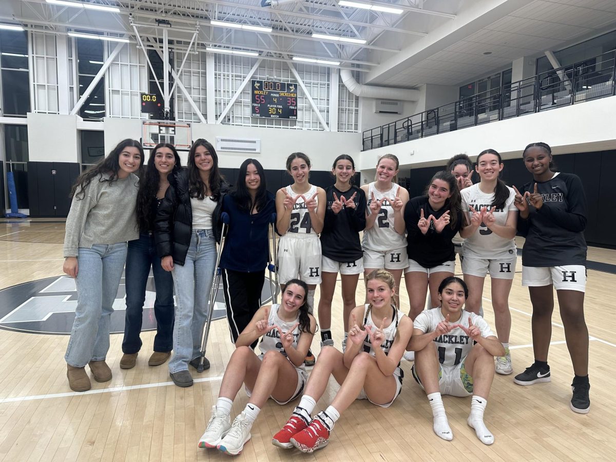 The girls basketball team celebrates a win over Covent of the Sacred Heart school. The team was led by Ashley Currie with 20 points. The girls currently sit at an overall record of 7-4. 