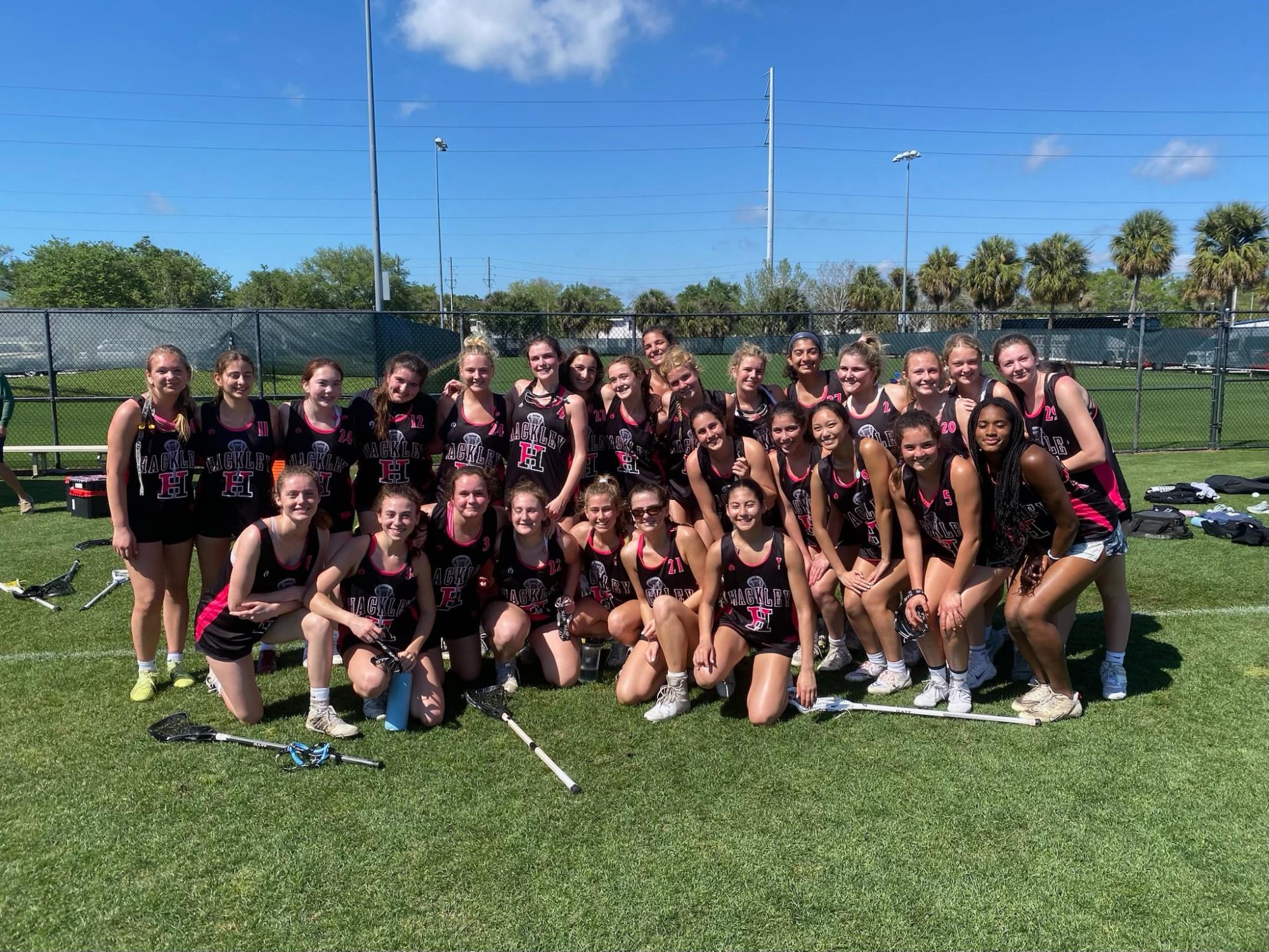 The girls lacrosse team poses before a game in Clearwater, Florida. The girls are coming off a NYSAIS Championship and look to repeat again this year. The team will lean on Kenyon commit and senior captain Daanya Mir and junior John Hopkins commit Brooke Koffler to provide some firepower on the attacking end. 